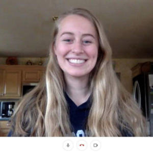 a blonde girl smiles for a photo while talking over video chat